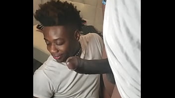 African-American submissive wearing a collar gets his face fucked