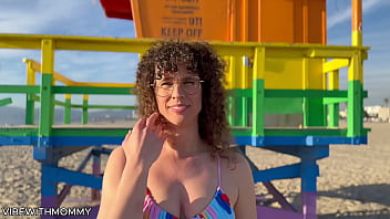 Mature Jewish woman engages in random sexual encounter with a stranger at the beach, focusing on her voluptuous figure and curly hair